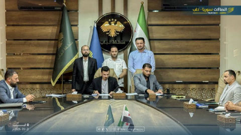 Contract signing ceremony at the Al-Bab district administration building